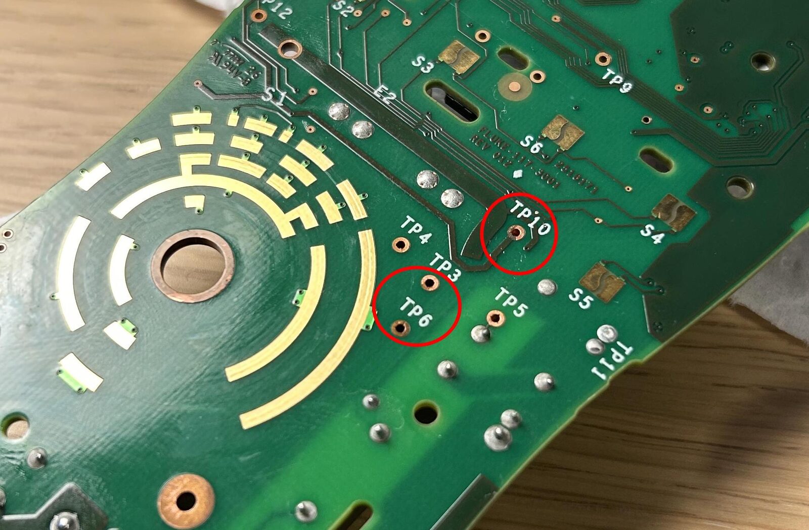 Fluke 115 PCB with corroded test point vias
