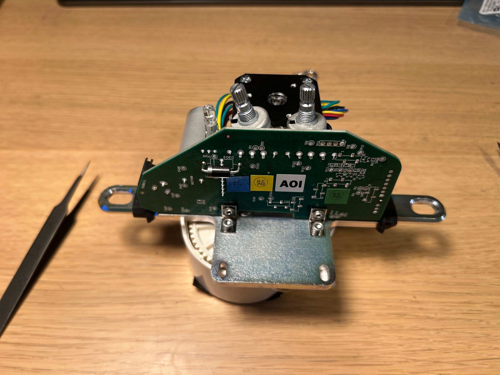 The two potentiometers mounted on the motor's circuit board